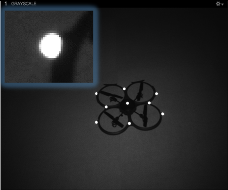 An image taken from an OptiTrack camera in Object mode, with an inset close-up of a single marker. 