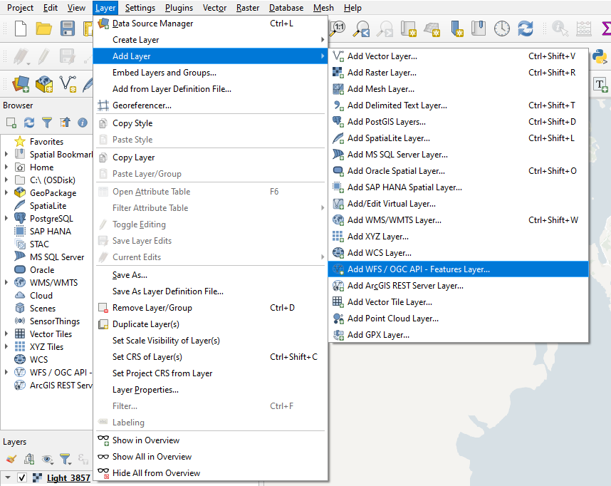 The Layer menu open to the Add layer sub-meny and Ad WFS / OGC API - Features Layer highlighted in QGIS