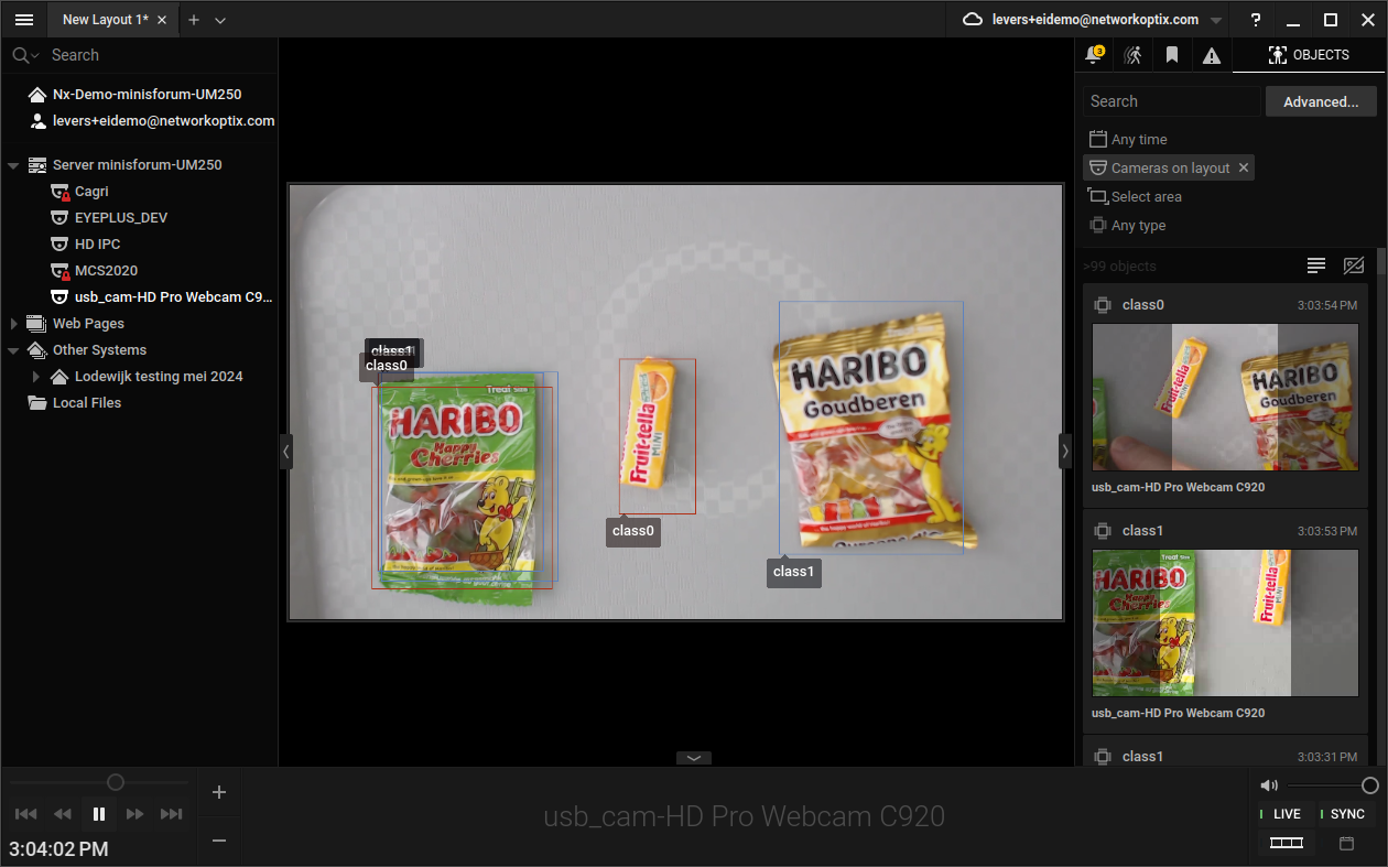 Camera feed showing bounding boxes drawn over detected objects by the Edge Impulse model