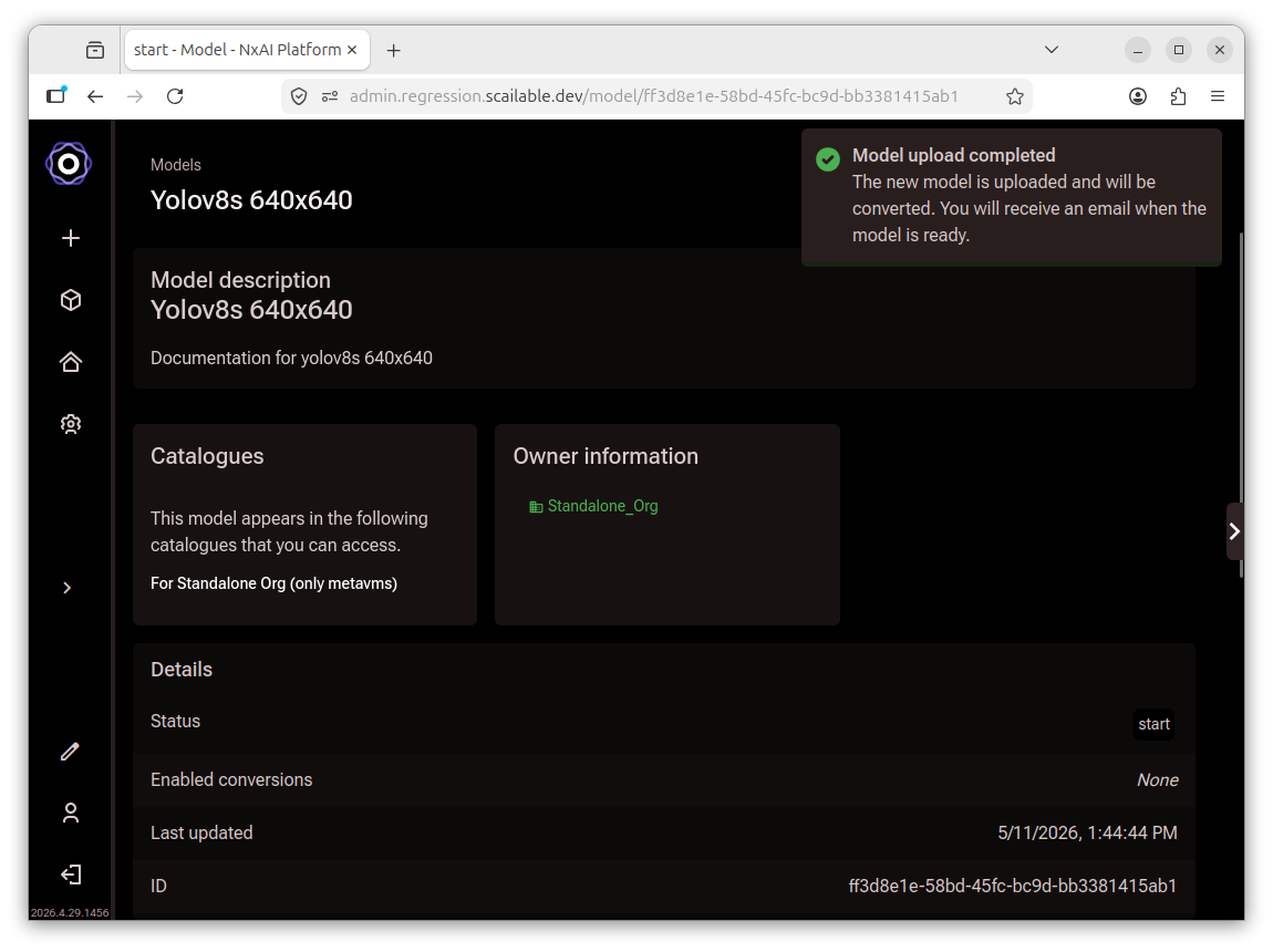 Model detail page showing a Model upload completed notification and the model status,
       catalogues, and owner information