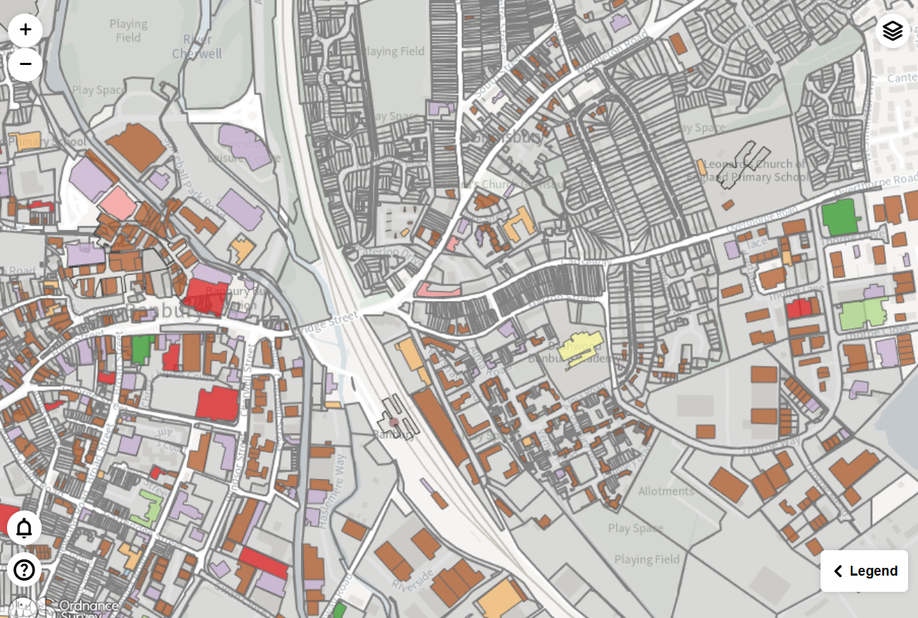 A screenshot of a map created by adding a WKT geometry field representing some buildings from the data model to the Features Layer: WKT or GeoJSON geometries field and styled using a categorical field